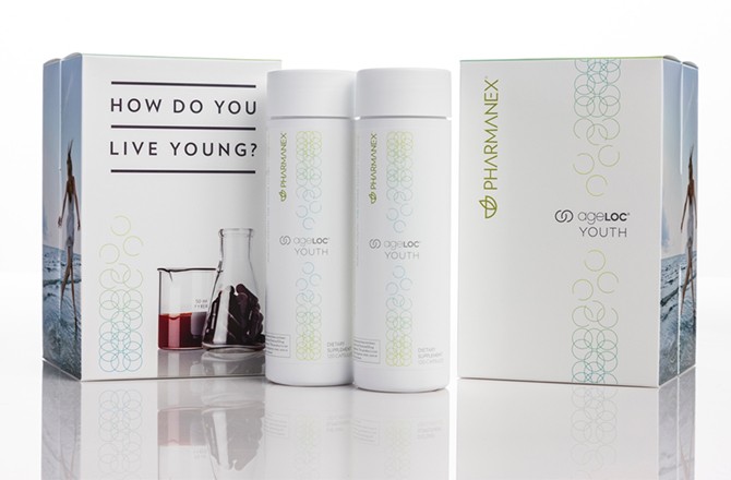 Nu Skin Pharmanex AgeLoc Youth product bottles and boxes on display.