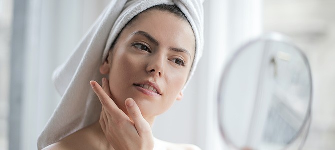 woman looking into a mirror