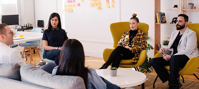 group of people sitting in an office - photo by You X Ventures on Unsplash