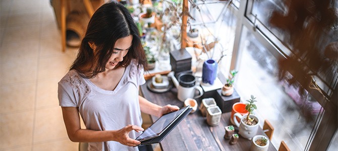 girl looking at a tablet 